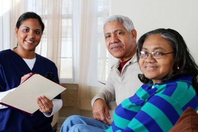 caregiver with elderly couple